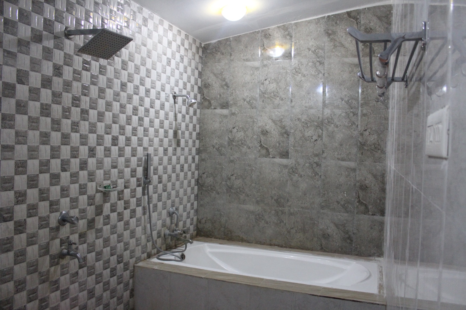 Bathroom with bathtub and walk-in shower
