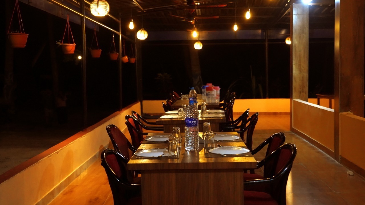 Tables set for dinner on the open-air terrace