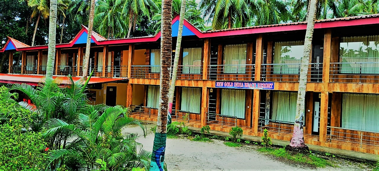 Olive Green Beach Resort building among palm trees