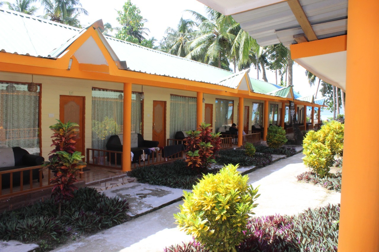 Garden cottages with seating on their verandas