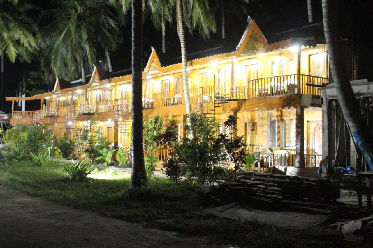 Wooden resort facade glowing after dark